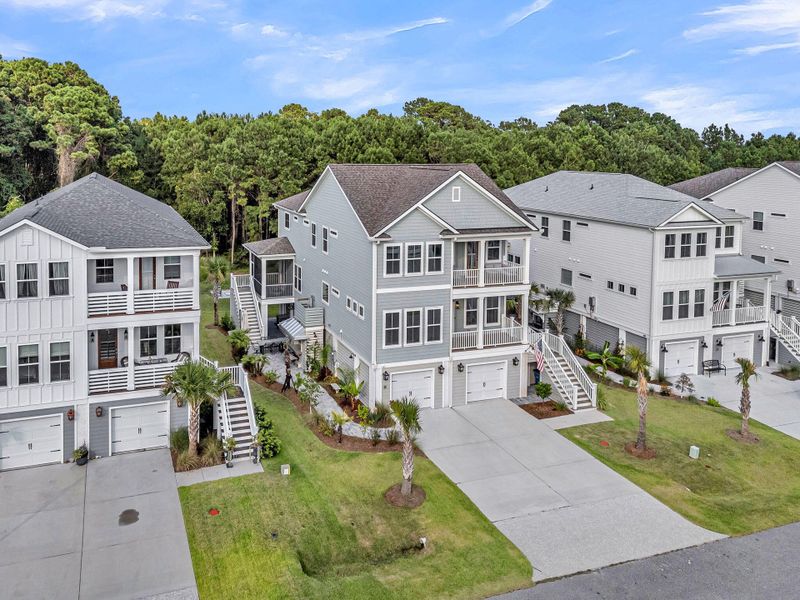 Front exterior of a new home in Overlook at Copahee Sound, Awendaw, SC, highlighting curb appeal (Image 25). Front exterior of a new home in Overlook at Copahee Sound, Awendaw, SC, highlighting curb appeal (Image 25).