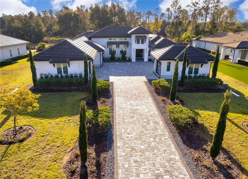 Front exterior of a new home in , Montverde, FL, highlighting curb appeal (Image 2). Front exterior of a new home in , Montverde, FL, highlighting curb appeal (Image 2).