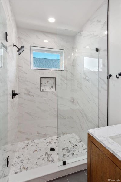 Tiled shower with glass door