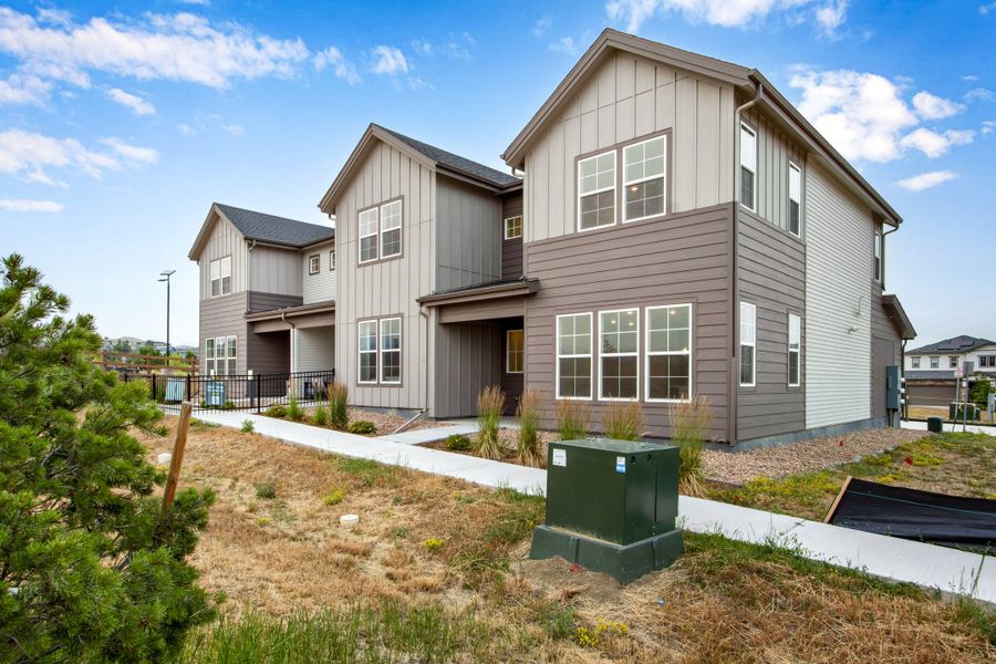 Front exterior of a new home in Candelas Townhomes, Arvada, CO, highlighting curb appeal (Image 27). Front exterior of a new home in Candelas Townhomes, Arvada, CO, highlighting curb appeal (Image 27).