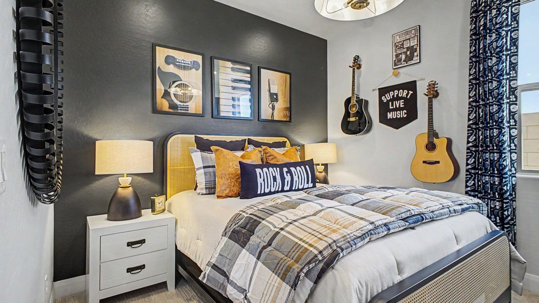 Guitar-themed secondary bedroom in this quick move-in new home by DRB Homes at Saguaro Hills at Vistancia. Guitar-themed secondary bedroom in this quick move-in new home by DRB Homes at Saguaro Hills at Vistancia.