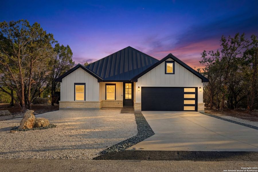 Front exterior of a new home in , Spring Branch, TX, highlighting curb appeal (Image 20). Front exterior of a new home in , Spring Branch, TX, highlighting curb appeal (Image 20).