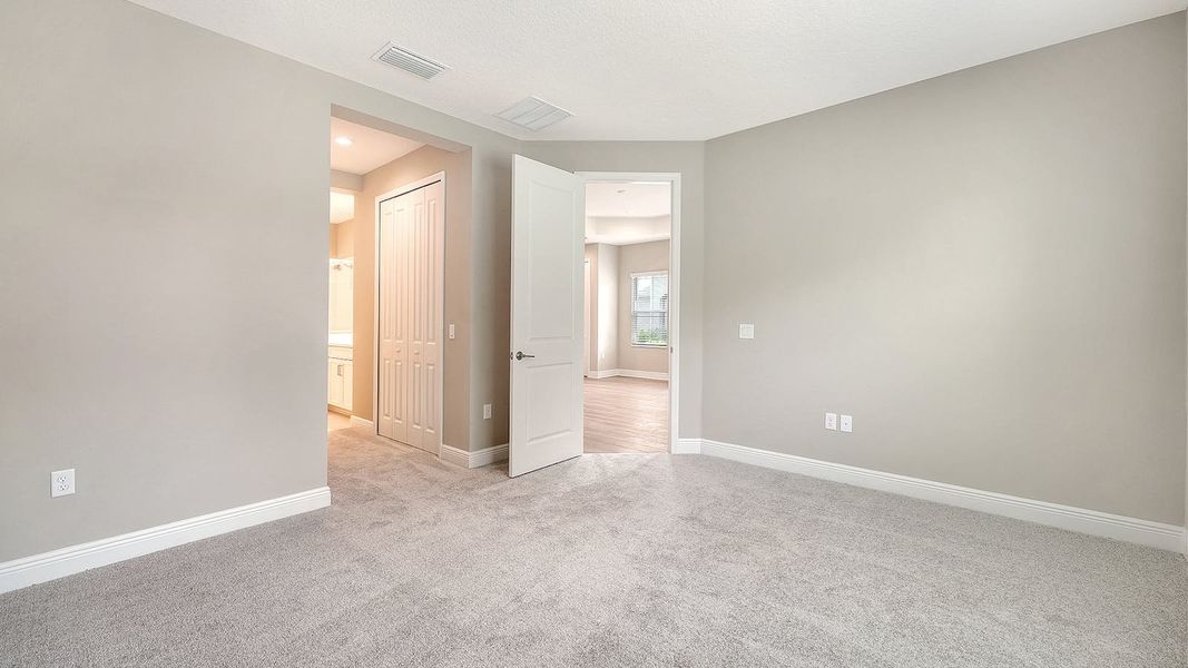Spacious, unfurnished interior of a new home in Wildleaf Real Estate and Homes for Sale in Parrish, FL - Neal Communities, Parrish (Image 16).