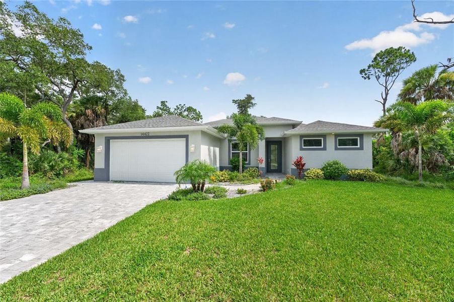 Front exterior of a new home in , Port Charlotte, FL, highlighting curb appeal (Image 29). Front exterior of a new home in , Port Charlotte, FL, highlighting curb appeal (Image 29).