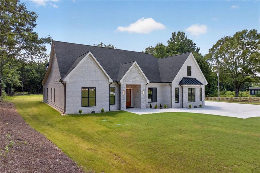 Front exterior of a new home in , Monroe, GA, highlighting curb appeal (Image 28). Front exterior of a new home in , Monroe, GA, highlighting curb appeal (Image 28).