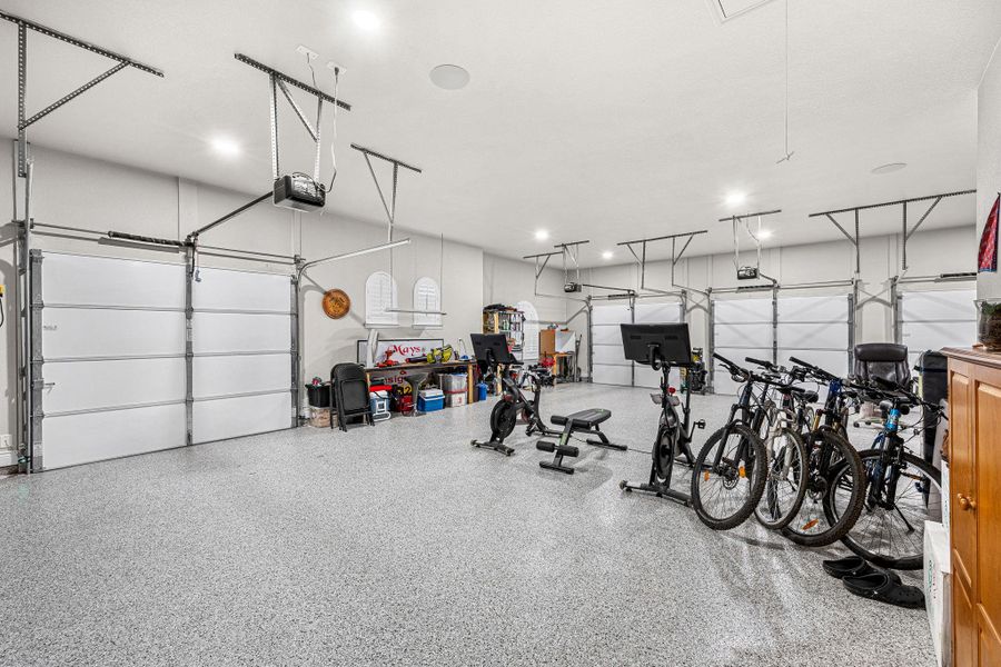 Plenty of space for vehicles and fitness equipment in this well-maintained multi-car garage. Plenty of space for vehicles and fitness equipment in this well-maintained multi-car garage.