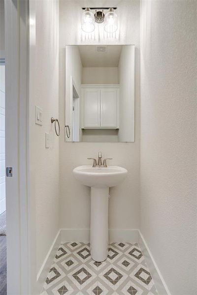 Bathroom with tile patterned floors and sink