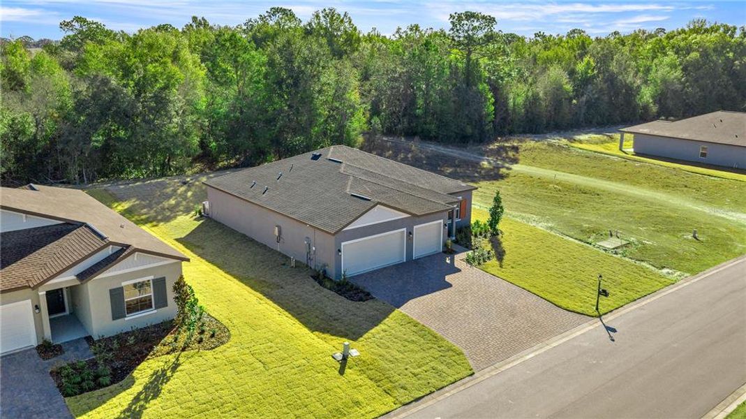 Front exterior of a new home in Juliette Falls, Dunnellon, FL, highlighting curb appeal (Image 2). Front exterior of a new home in Juliette Falls, Dunnellon, FL, highlighting curb appeal (Image 2).