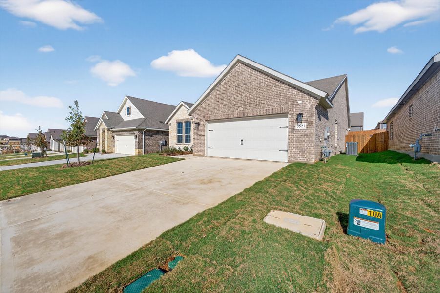 Front exterior of a new home in Liberty Pointe, Gainesville, TX, highlighting curb appeal (Image 21). Front exterior of a new home in Liberty Pointe, Gainesville, TX, highlighting curb appeal (Image 21).