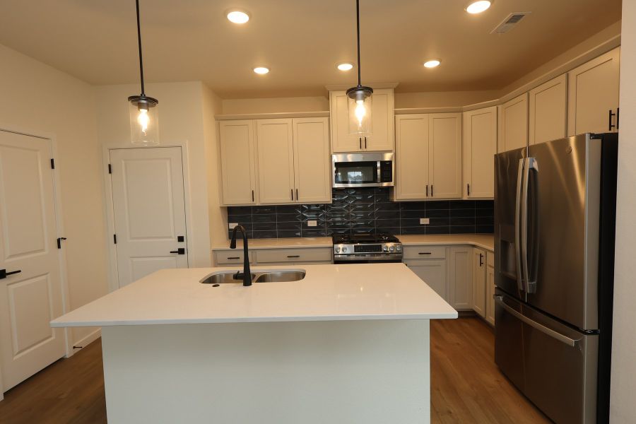 Furnished interior view inside a new home in Revel Crossing at Wolf Ranch – The Ascent Collection, Colorado Springs (Image 4).