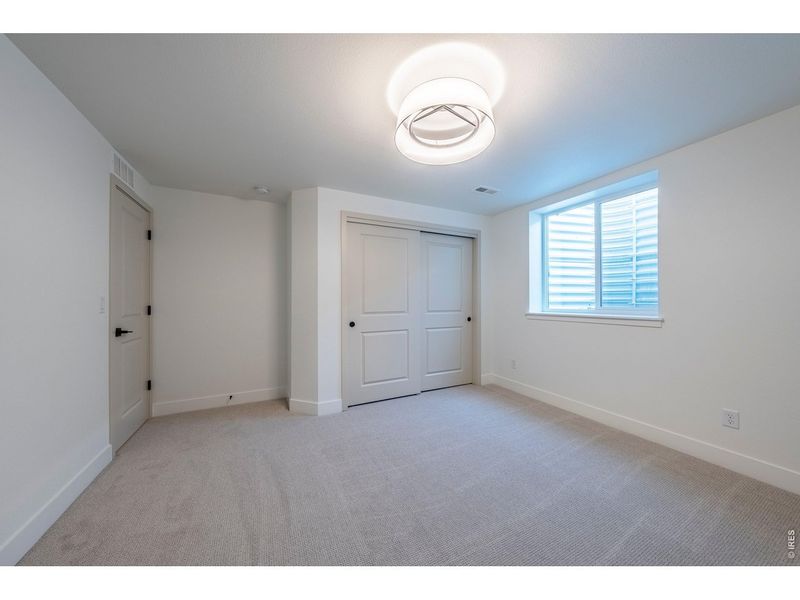 Spacious, unfurnished interior of a new home in Greenspire At Windsor Lake, Windsor (Image 41).
