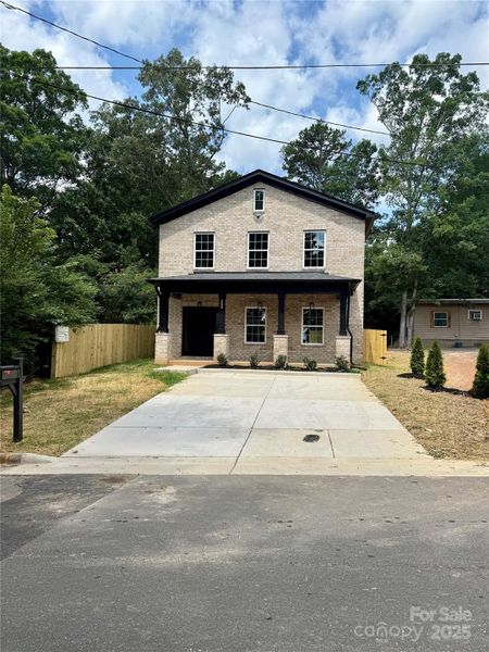 Front exterior of a new home in , Albemarle, NC, highlighting curb appeal (Image 22).