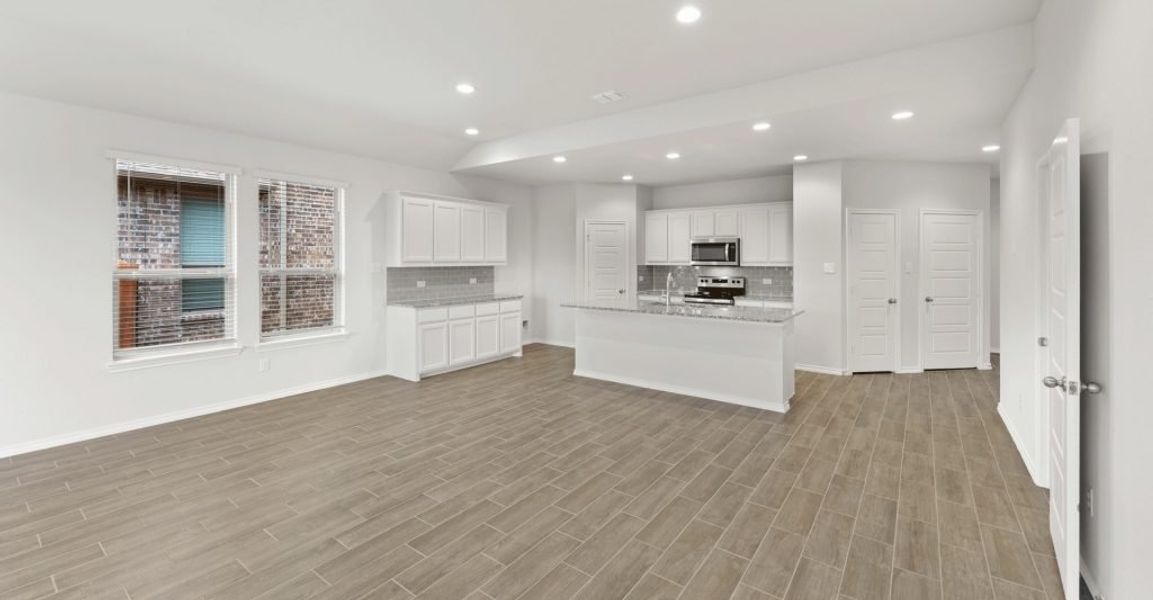 Representative exterior photo of a completed home built from the Raleigh by Impression Homes in Baker Farms, Cleburne, TX (Image 9).