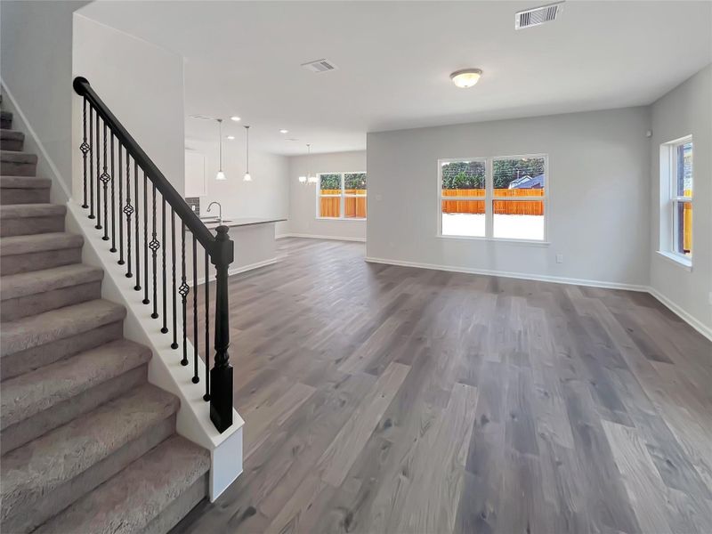 The Oriole II- Family Room and Staircase. Home under construction, photo used for illustrative purposes only, colors and options will vary.