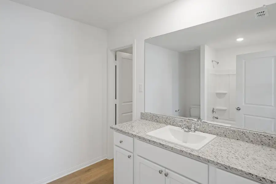 Furnished interior view inside a new home in Cypress Trails at Bauer Landing, Hockley (Image 5).
