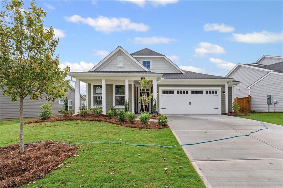Front exterior of a new home in The Reserve At Liberty Park, Braselton, GA, highlighting curb appeal (Image 2). Front exterior of a new home in The Reserve At Liberty Park, Braselton, GA, highlighting curb appeal (Image 2).