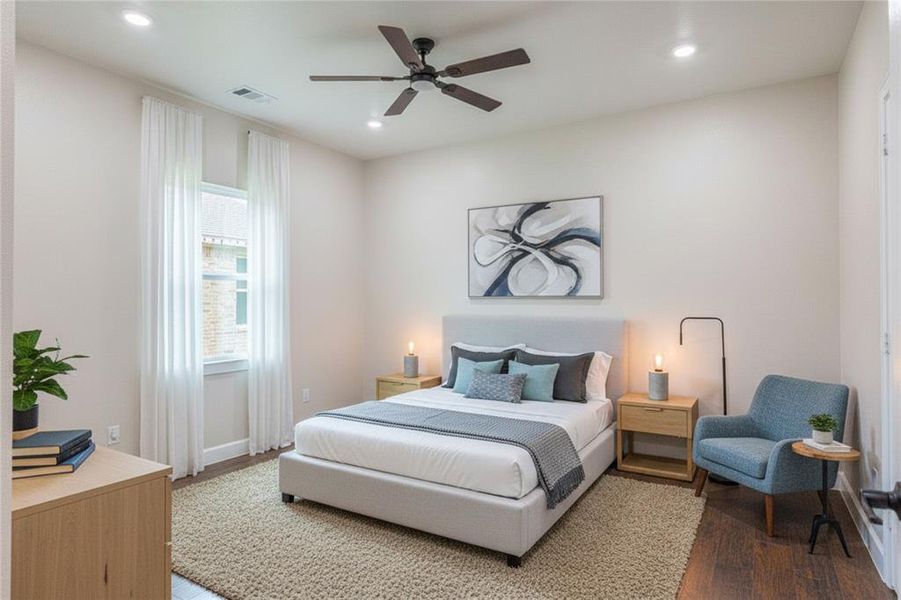 Bedroom with wood finished floors, ceiling fan, and recessed lighting Bedroom with wood finished floors, ceiling fan, and recessed lighting