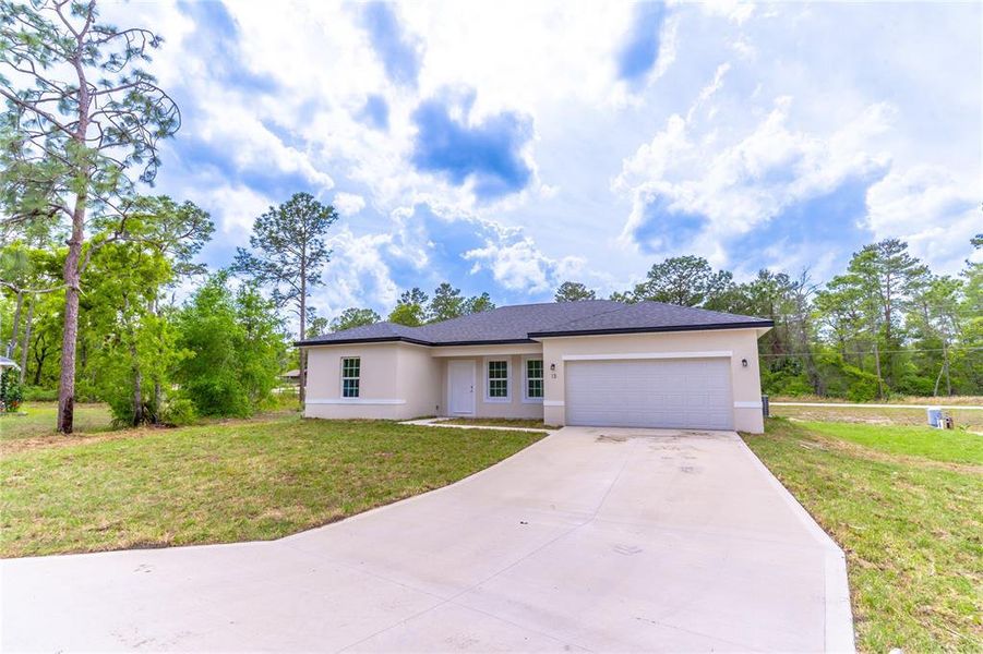 Front exterior of a new home in , Ocala, FL, highlighting curb appeal (Image 16).