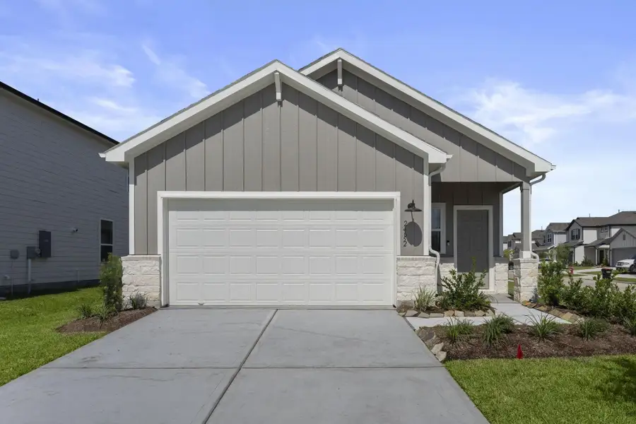 Front exterior of a new home in Peppervine, Porter, TX, highlighting curb appeal (Image 2).