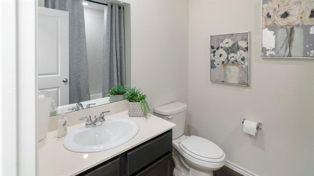 Bathroom featuring vanity and a shower with curtain