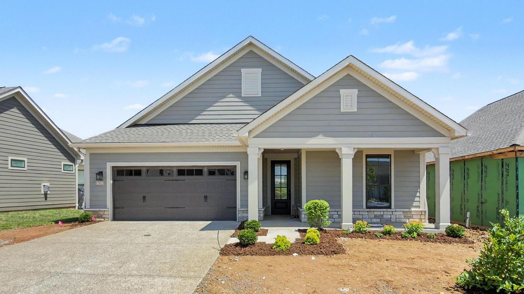 Front exterior of a new home in The Courtyards at Curry Farms, Louisville, KY, highlighting curb appeal (Image 1). Front exterior of a new home in The Courtyards at Curry Farms, Louisville, KY, highlighting curb appeal (Image 1).