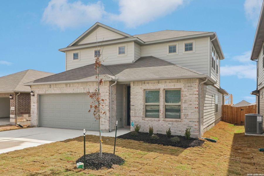 Front exterior of a new home in Legendary Trails - Premier Series, Cibolo, TX, highlighting curb appeal (Image 24).