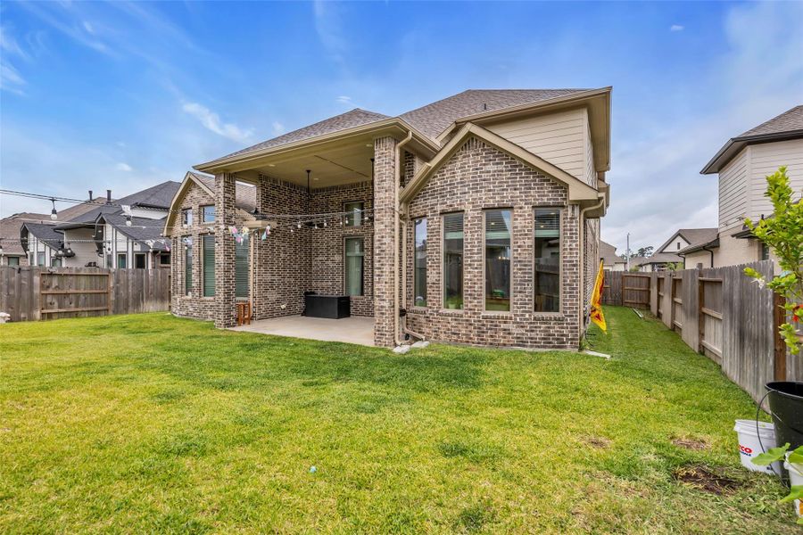 Exterior details and patio area of a home in , Conroe (Image 3).