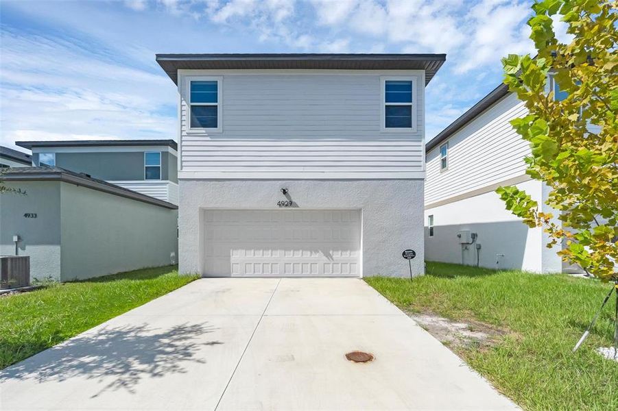 Front exterior of a new home in , St. Cloud, FL, highlighting curb appeal (Image 27).