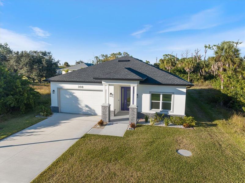 Front exterior of a new home in , Rotonda West, FL, highlighting curb appeal (Image 2).