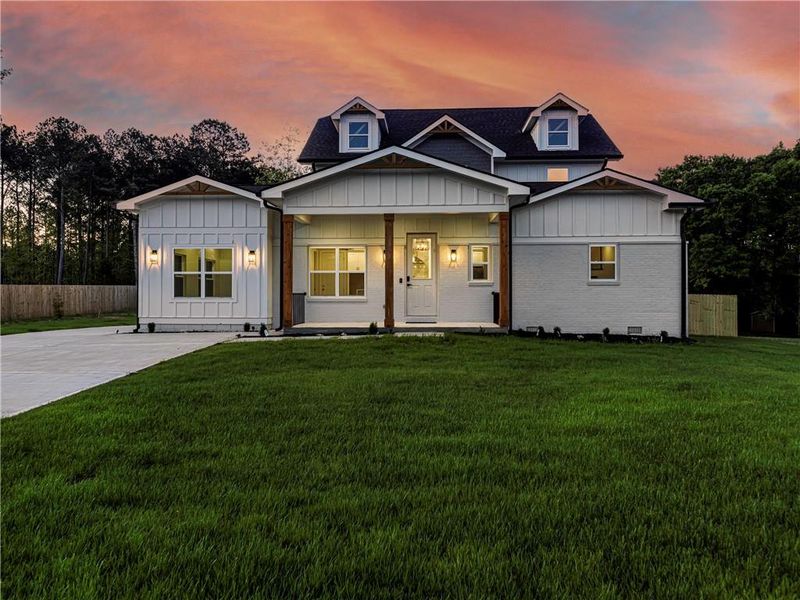 Front exterior of a new home in , Loganville, GA, highlighting curb appeal (Image 25).