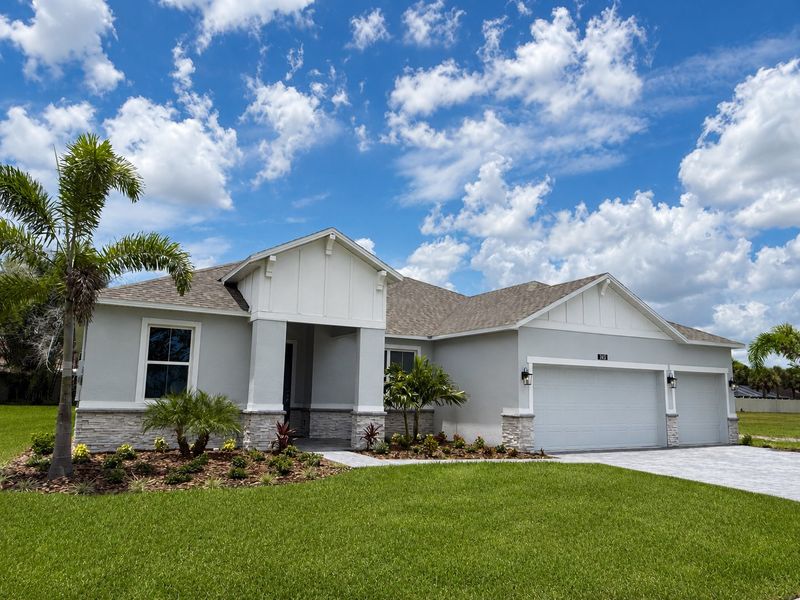 Front exterior of a new home in Country Club Estates, Palm Bay, FL, highlighting curb appeal (Image 1). Front exterior of a new home in Country Club Estates, Palm Bay, FL, highlighting curb appeal (Image 1).