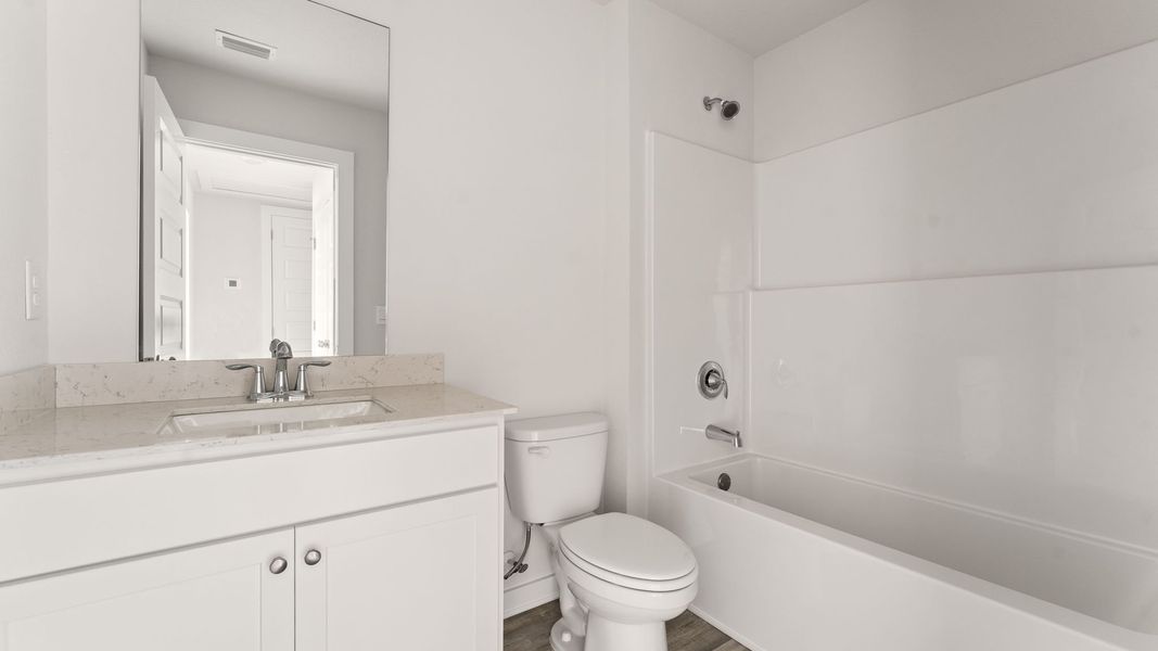 Furnished interior view inside a new home in Genoa Landing Townhomes, Freeport (Image 14).