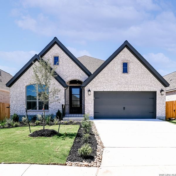 Front exterior of a new home in Meadows of Mill Creek, Seguin, TX, highlighting curb appeal (Image 21). Front exterior of a new home in Meadows of Mill Creek, Seguin, TX, highlighting curb appeal (Image 21).