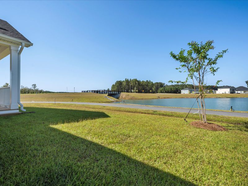 Exterior details and patio area of a home in The Coves at Lakes of Cane Bay, Summerville (Image 21).