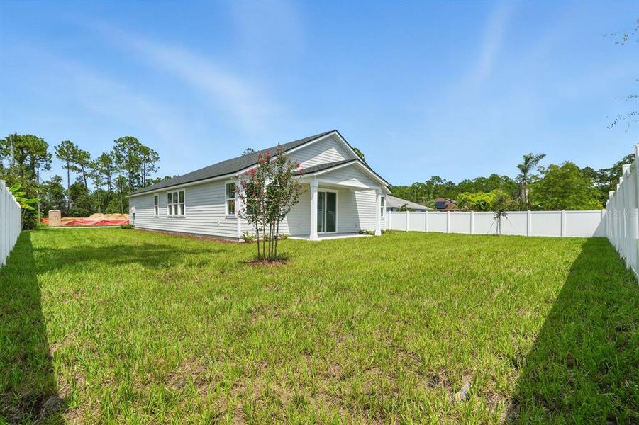 Front exterior of a new home in Palm Coast Homes, Palm Coast, FL, highlighting curb appeal (Image 2).