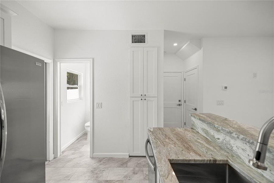 View from Kitchen to Half Bathroom/Entry to Garage