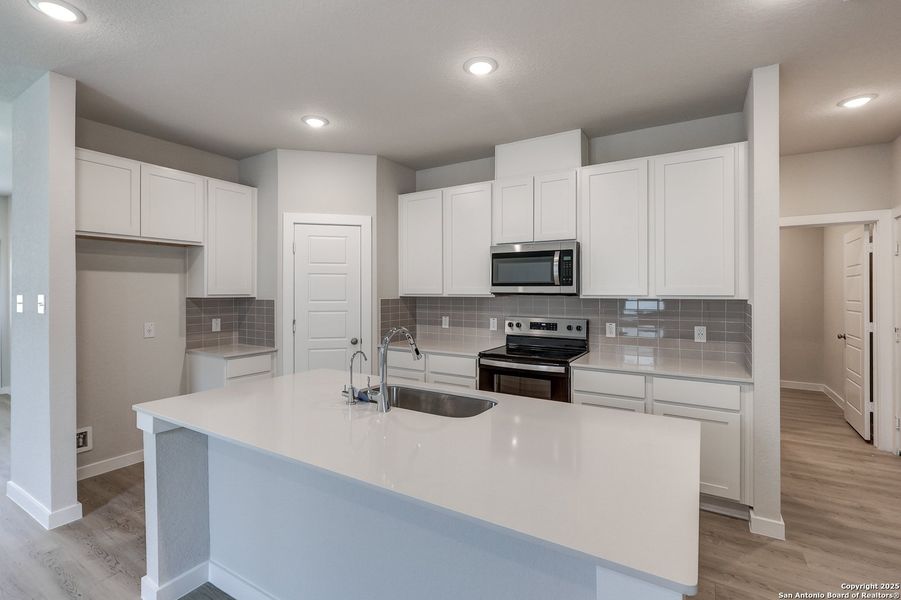 Furnished interior in a model home at Cinco Lakes in San Antonio (Image 17).