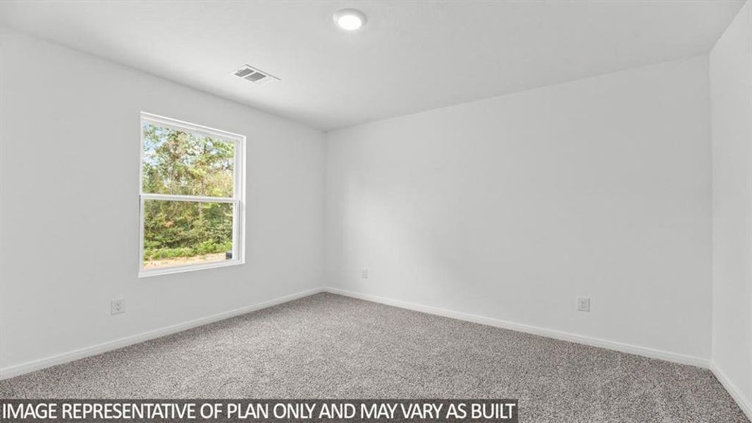 Spare room featuring light colored carpet and baseboards