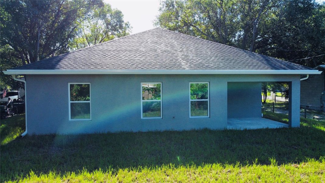 Front exterior of a new home in , Okeechobee, FL, highlighting curb appeal (Image 19).