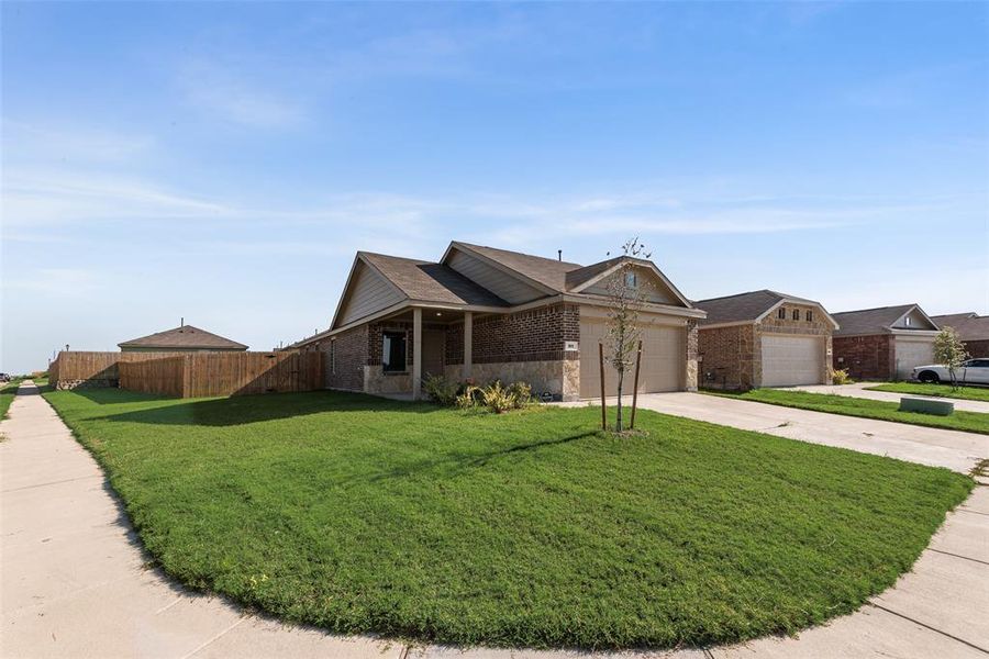 Front exterior of a new home in , Forney, TX, highlighting curb appeal (Image 1). Front exterior of a new home in , Forney, TX, highlighting curb appeal (Image 1).