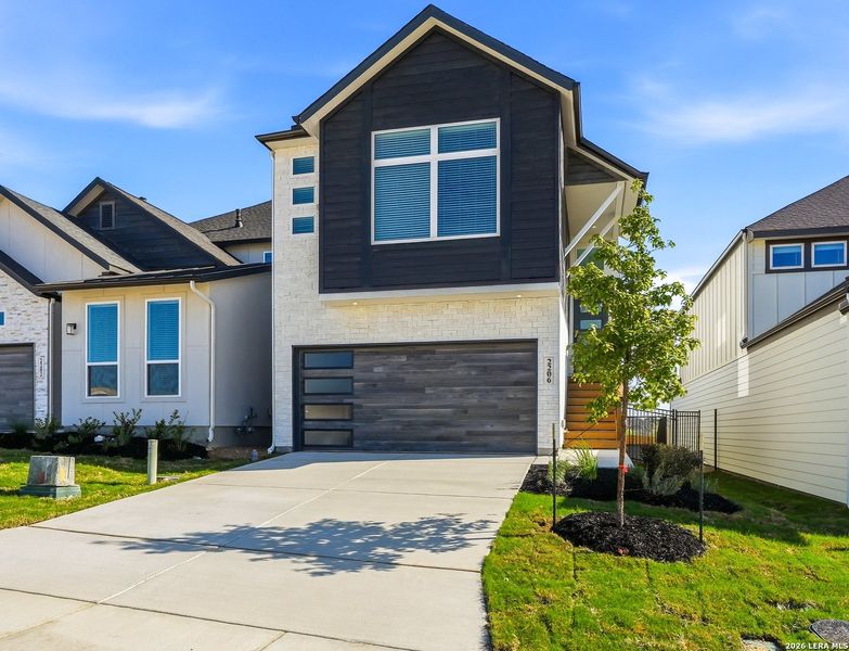 Front exterior of a new home in Prominence Urban, San Antonio, TX, highlighting curb appeal (Image 1). Front exterior of a new home in Prominence Urban, San Antonio, TX, highlighting curb appeal (Image 1).