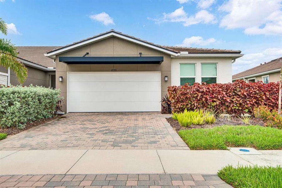 Front exterior of a new home in , Venice, FL, highlighting curb appeal (Image 28). Front exterior of a new home in , Venice, FL, highlighting curb appeal (Image 28).