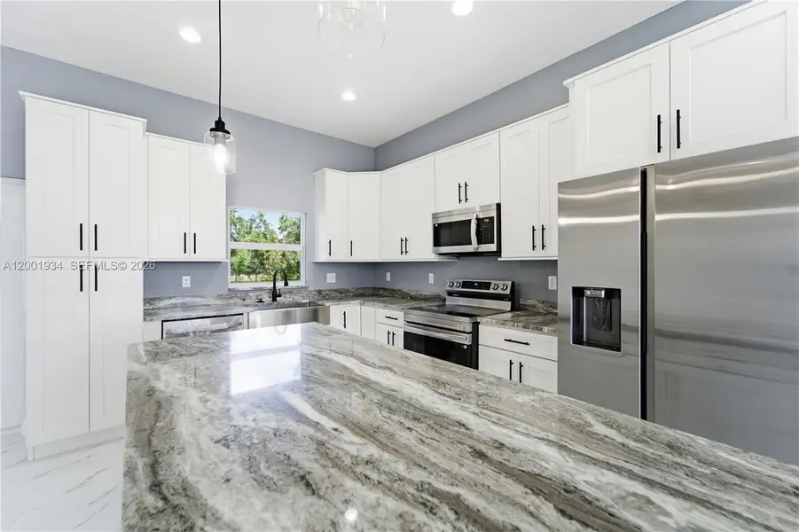 Furnished interior view inside a new home in , Port St. Lucie (Image 11).