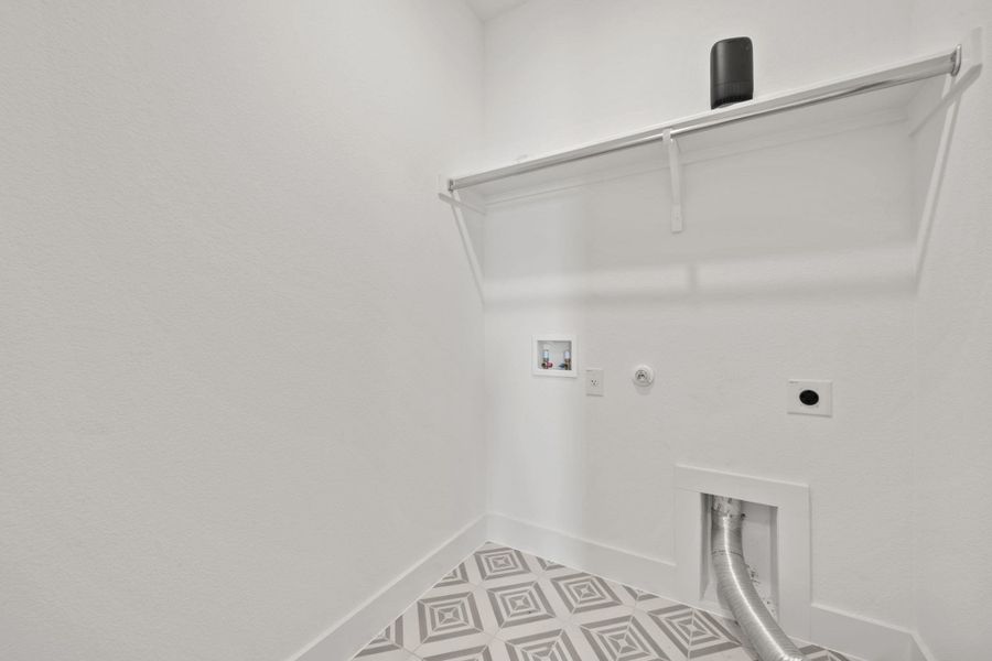 Washroom featuring hookup for a gas dryer, washer hookup, and electric dryer hookup