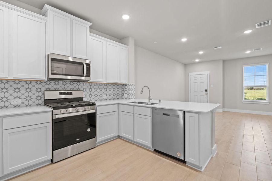 The open layout invites laughter and warmth, making it the perfect backdrop for family gatherings or cozy brunches with friends.