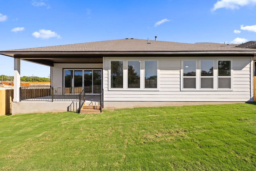 Exterior details and patio area of a home in Lariat, Liberty Hill (Image 28).