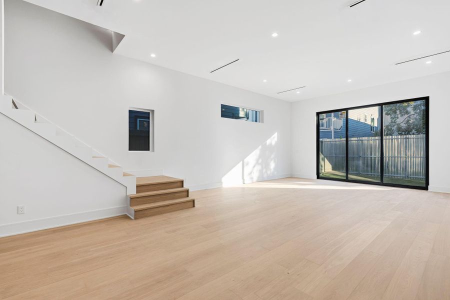 Open concept dining opening to family room.