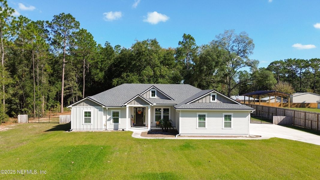Front exterior of a new home in , Keystone Heights, FL, highlighting curb appeal (Image 1). Front exterior of a new home in , Keystone Heights, FL, highlighting curb appeal (Image 1).