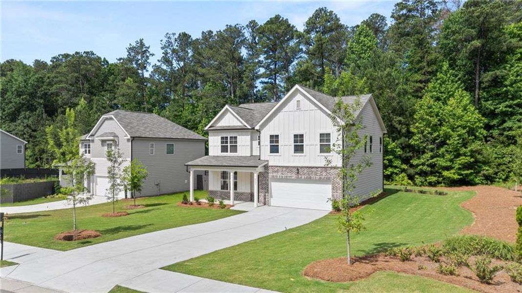 Front exterior of a new home in Whisper Creek, Atlanta, GA, highlighting curb appeal (Image 23). Front exterior of a new home in Whisper Creek, Atlanta, GA, highlighting curb appeal (Image 23).