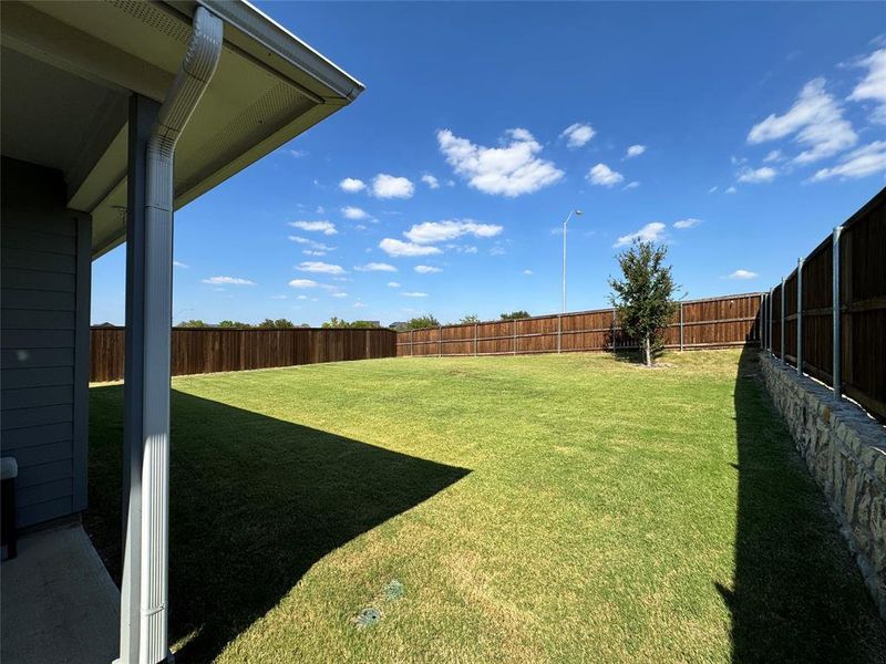 Fenced backyard featuring a patio Fenced backyard featuring a patio